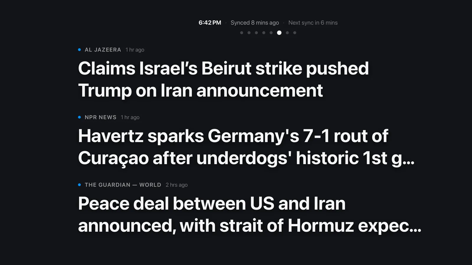 Marquee Reader's ambient screensaver on Apple TV — live headlines from your feeds drifting above the time of day
